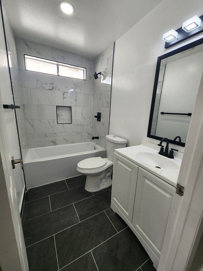 Photo - 1451 W 146th St Townhome