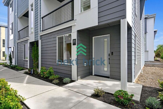 Foto del edificio - Brand-New 2026 Townhome | 3 Bed | 2.5 Bath | 1,560 Sq Ft | EV Garage | A/C Included