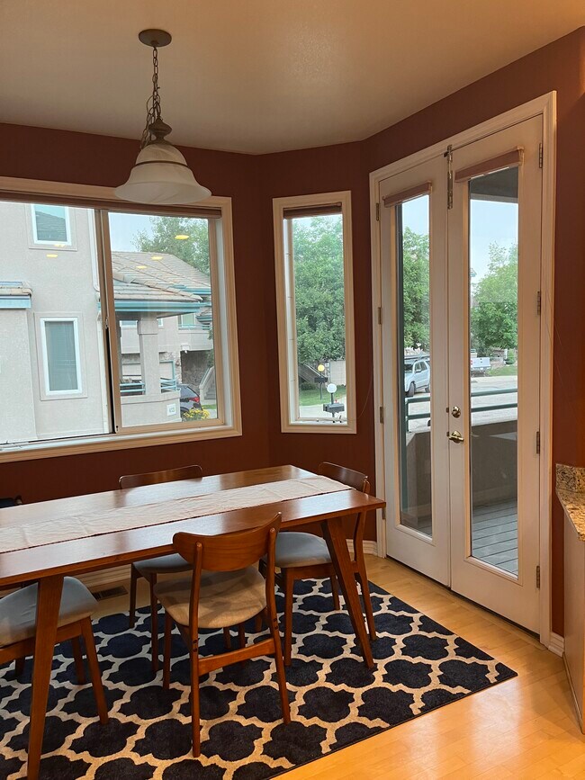 Eat-in kitchen with French doors to balcony - 4309 Clay Commons Ct