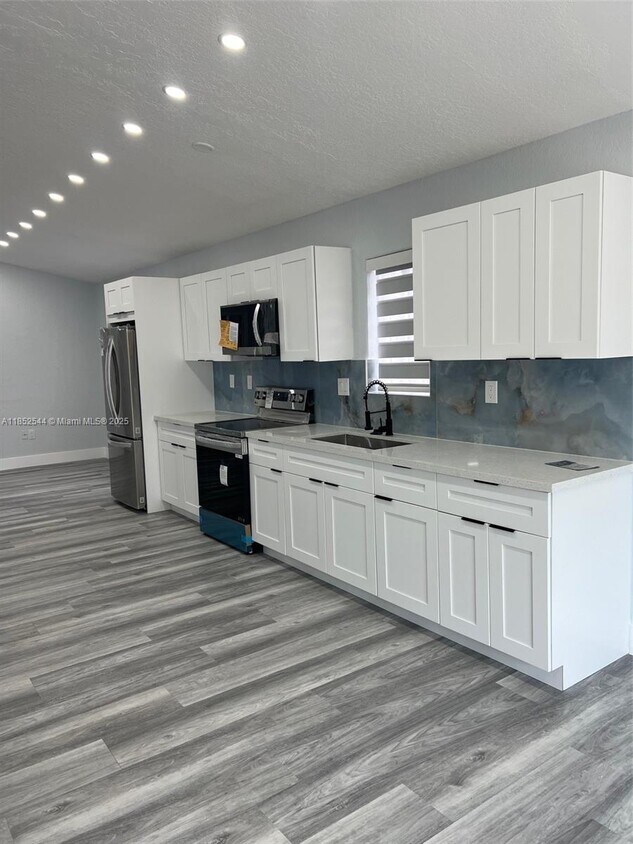 Foto principal - 10057 NW 127th St