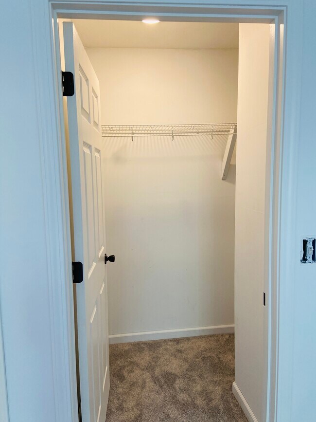 Walk-in closet of master - 127 W Barnes Ave