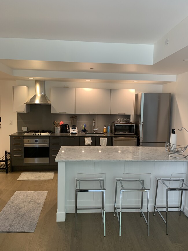 Counter Seating at 8' Marble Kitchen Island - 1075 Market St