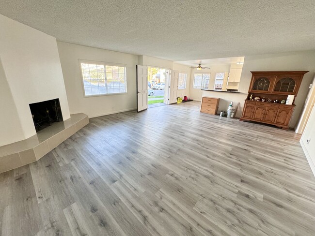 Living Room (18ft. x 19ft.) & Fireplace (pardon our dust) - 2117 Locust Ave