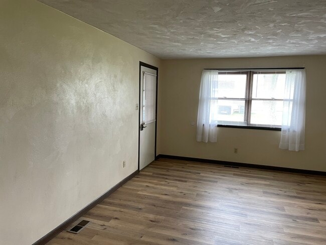 115 S clinton living room Grass Roots Properties LLC - 115 S Clinton St