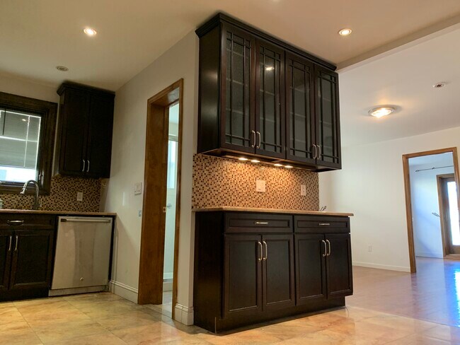 Right side of Kitchen Glass Cabinet - 7014 8th Ave
