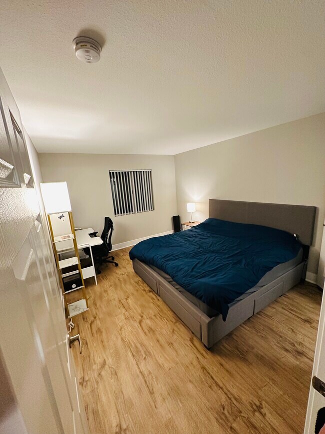 bedroom with desk - 3850 Poppyseed Ln
