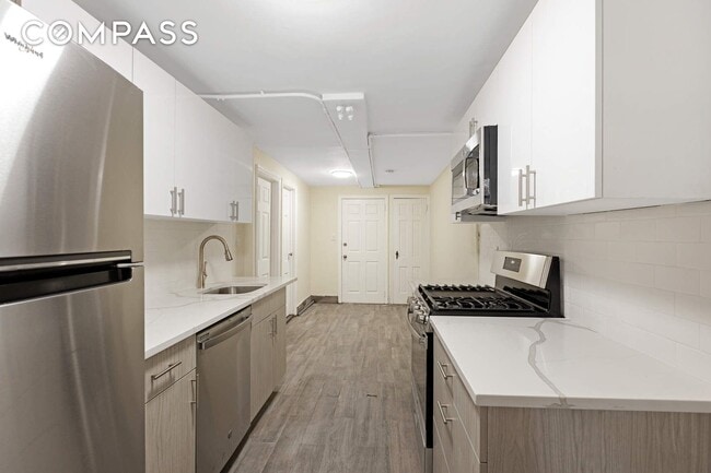 Photo - 32-84-84 46th St Townhome