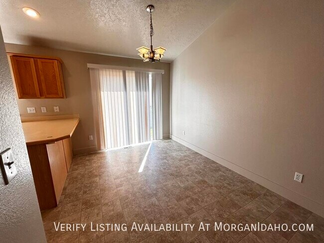 Building Photo - 2-car garage in convenient location w/ pat...