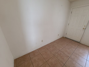 Building Photo - Open , bright, airy all tile unit