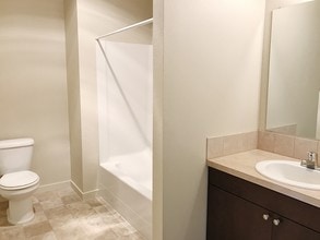 Quartz Dark Bathroom - Stoneplace Apartment Homes