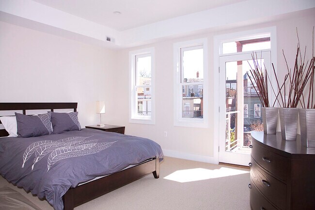 Spacious upstairs bedroom with en-suite bath, ample natural light - 1123 6th St NW