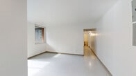 Unit 7B at 352 Nepperhan Ave in Yonkers, NY offers a practical and efficient single-floor layout accommodating three bedrooms, one full bathroom, and a dedicated kitchen. The interior is finished with crisp white walls and light-toned tile flooring throughout, creating a clean and bright atmosphere. Natural light filters into several rooms through windows that offer views of surrounding greenery and the building exterior.

The primary bedroom is a well-proportioned space featuring a double-door closet, offering ample storage. The two additional bedrooms are modestly sized, with one benefiting from a window that brings in natural light and outdoor views. All bedrooms share the same clean, neutral aesthetic.

The kitchen is thoughtfully arranged with white cabinetry, granite-style countertops, a gas range, an over-the-range microwave, a full-size refrigerator, and a sink — all positioned to maximize the available space. A separate windowed area adjacent to the kitchen provides additional counter space and cabinetry, ideal for added storage or a dining nook.

The full bathroom is outfitted with a tub-shower combination featuring built-in corner shelving, chrome fixtures, and a wood-toned vanity. Multiple hallways connect the rooms, contributing to a logical and navigable floor plan throughout the unit.