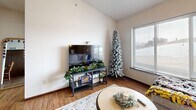 Located at 1032 Newton Rd in Iowa City, Iowa, this well-appointed one-bedroom, one-bathroom unit offers a practical and comfortable single-floor layout. The open-concept main living area seamlessly integrates the living room, dining room, and kitchen, maximizing the use of space. The living room is bright and welcoming, featuring hardwood-style flooring, a ceiling fan, and a large window that allows generous natural light and outdoor views. The kitchen is a functional highlight, showcasing warm medium-toned cabinetry, granite countertops, stainless steel appliances including a refrigerator, range, and microwave, and a peninsula that provides additional prep and dining space. The bedroom is a comfortable retreat equipped with a ceiling fan, a large closet with double doors, and a window with views to the outside. The full bathroom includes a tub-shower combination and a vanity. Additional conveniences include an in-unit laundry area and a dedicated closet for storage. Hardwood-style flooring runs consistently throughout the unit, contributing to a cohesive and clean aesthetic. This unit offers a well-rounded layout suitable for everyday living in Iowa City.