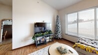 Located at 1032 Newton Rd in Iowa City, Iowa, this well-appointed one-bedroom, one-bathroom unit offers a practical and comfortable single-floor layout. The open-concept main living area seamlessly integrates the living room, dining room, and kitchen, maximizing the use of space. The living room is bright and welcoming, featuring hardwood-style flooring, a ceiling fan, and a large window that allows generous natural light and outdoor views. The kitchen is a functional highlight, showcasing warm medium-toned cabinetry, granite countertops, stainless steel appliances including a refrigerator, range, and microwave, and a peninsula that provides additional prep and dining space. The bedroom is a comfortable retreat equipped with a ceiling fan, a large closet with double doors, and a window with views to the outside. The full bathroom includes a tub-shower combination and a vanity. Additional conveniences include an in-unit laundry area and a dedicated closet for storage. Hardwood-style flooring runs consistently throughout the unit, contributing to a cohesive and clean aesthetic. This unit offers a well-rounded layout suitable for everyday living in Iowa City.