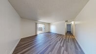 Located at 1500 Karen Ave in Las Vegas, NV, this 2-bedroom, 1-bathroom unit is thoughtfully laid out across a single floor. Wood-style plank flooring runs throughout the entire space, providing a cohesive and modern aesthetic, while textured ceilings add a classic touch to each room.

The living room is a comfortable, open area featuring a sliding glass door that invites natural light and provides outdoor access. Adjacent to the living area, the kitchen is equipped with warm wood cabinetry, grey countertops, and included appliances, offering functional storage and workspace.

The primary bedroom is a well-proportioned room featuring a large sliding closet and a window that brings in natural light. The second bedroom is equally bright, with its own window and easy access to the hallway. Both bedrooms share wood-style flooring consistent with the rest of the unit.

The full bathroom includes a wood-toned vanity with grey countertop, an under-sink cabinet for storage, and a full tub-shower combination. A dedicated entrance and hallway connect all rooms efficiently, creating a practical and comfortable flow throughout. This unit offers a clean, move-in ready layout suited for everyday living in central Las Vegas.