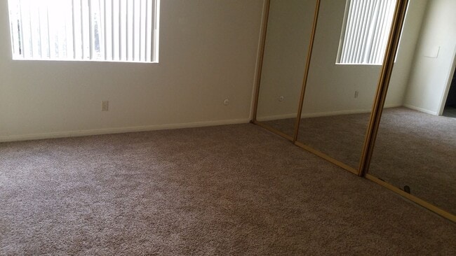 Building Photo - 3 bedroom, 2 bath, ground floor unit, and private patio.