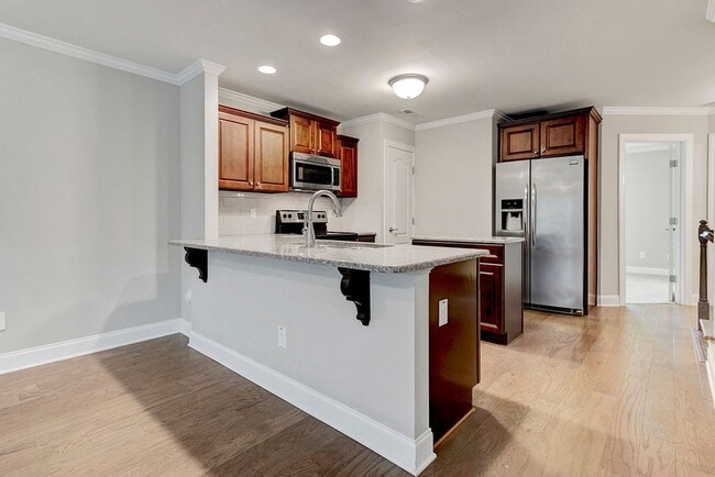 Building Photo - MOVE IN READY! – Gorgeous 4BR/4BA Townhome in Villages of Apex, 1 mile to DT Apex!