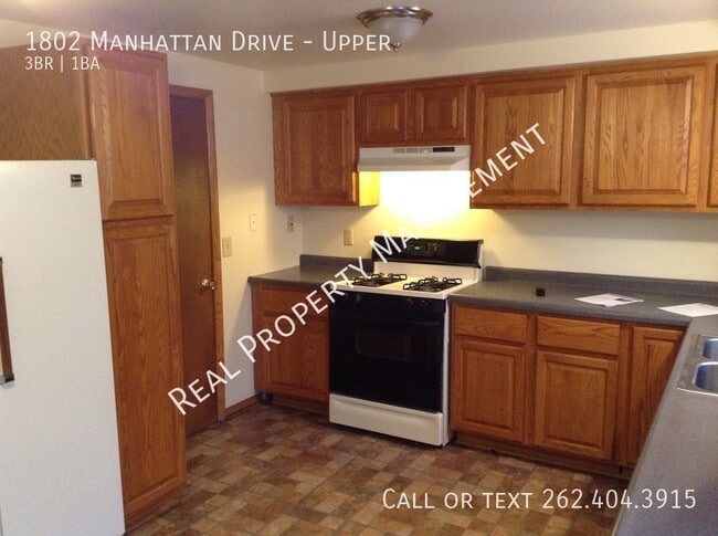 Building Photo - 1802 Manhattan Dr