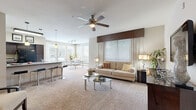 Located in Houston's 77055 zip code, this well-appointed 2-bedroom, 3-bathroom single-floor residence offers a thoughtfully designed layout that balances comfort and functionality. The open-concept living room features plush carpeting, vaulted ceilings with a ceiling fan, and generous wall space, creating a bright and airy atmosphere. It flows seamlessly into the dining area, which is bathed in natural light through large windows and a glass door that frame outdoor views. The kitchen is equipped with rich dark-espresso cabinetry, granite-style countertops, tile flooring, and a full suite of black appliances, including a refrigerator, range, microwave, and dishwasher. The primary bedroom is a spacious retreat with vaulted ceilings, a ceiling fan, soft carpeting, and closet access. The second bedroom offers dual windows with outdoor views and warm wood-toned furnishing space. Three full bathrooms serve the residence, one featuring a tiled tub-shower combination. A dedicated in-unit laundry room with stacked washer and dryer and built-in wire shelving adds everyday convenience. Two hallways and two closets complete the practical layout of this well-rounded Houston residence.