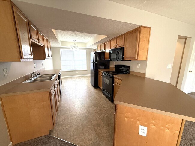 Building Photo - LARGE 2 Bedroom 2 1/2 Bath Townhome with Full Finished Basement and 1 Car Garage