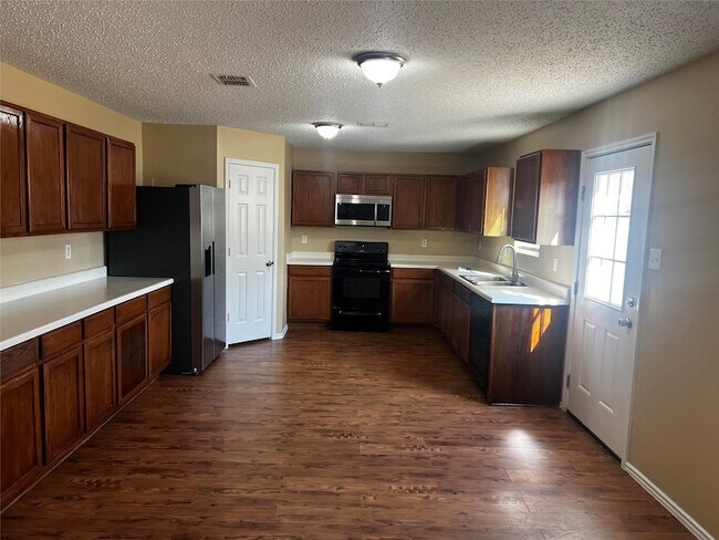 Foto del edificio - 1724 Creek Bend Ln