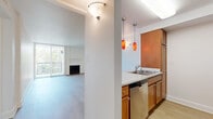 Located at 3227 S Parker Rd in Denver, Colorado, this one-bedroom, two-bathroom residence offers a thoughtfully laid-out single-level floor plan. The bright and open living room serves as the heart of the home, featuring light wood-tone flooring, crisp white walls, and a classic fireplace with a brick surround. A large sliding glass door floods the space with natural light and provides direct access to an outdoor balcony area. The living area flows seamlessly into the kitchen, which is accessible via a pass-through counter opening — ideal for everyday convenience. The kitchen is equipped with warm honey-toned cabinetry, light stone countertops, and stainless steel appliances including a range and over-the-range microwave. The bedroom is carpeted for comfort and includes a dedicated closet, offering a quiet retreat from the main living areas. Two bathrooms serve the residence, one of which features warm wood cabinetry with a vanity sink and an adjacent tub-shower combination finished with clean white tile surround. Hallways connect the rooms efficiently throughout the layout. The overall ambiance is clean, neutral, and move-in ready, making this Denver residence a practical and comfortable home.