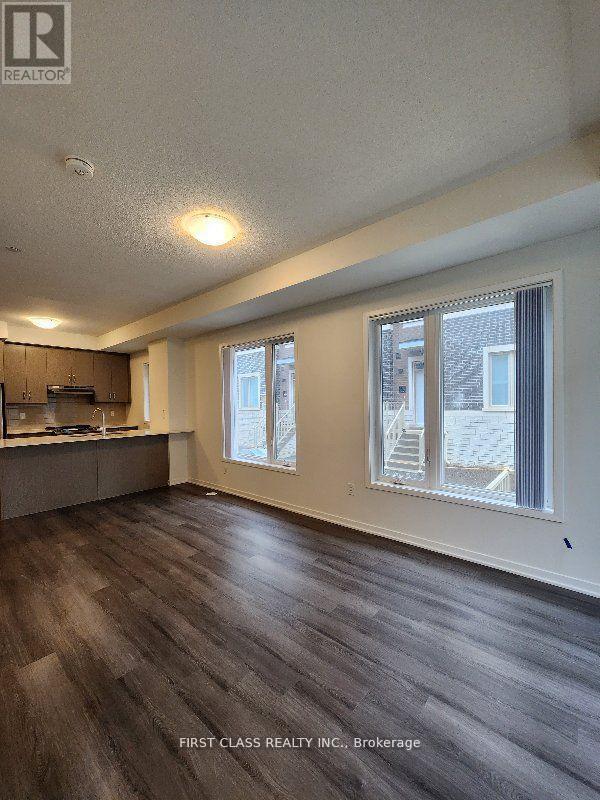 Photo du bâtiment - 151-151 Honeycrisp Cres