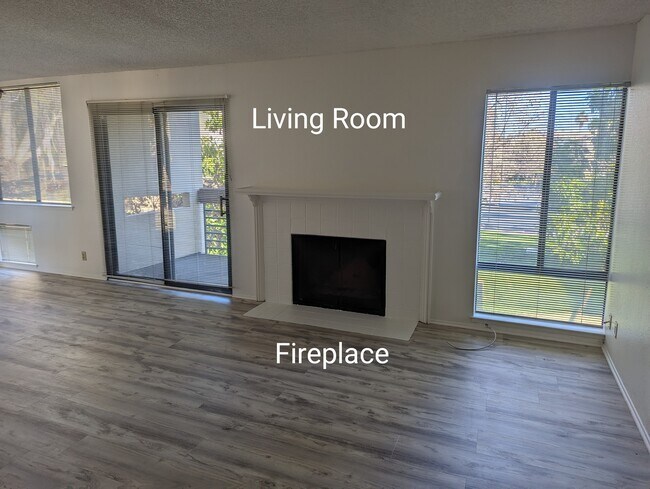 Living Room with Fireplace and Balcony - 902 Beach Park Blvd