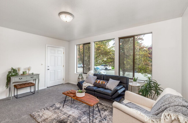 Living room of unit, lots of natural light in the space. - 2120 Highland Ave