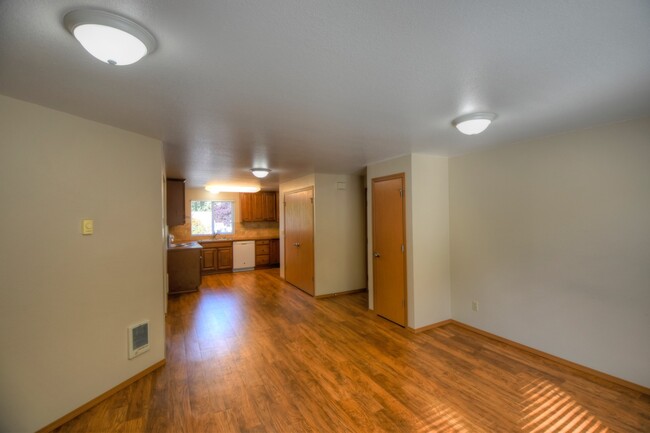 Solid surface floors throughout, except carpeted bedrooms. - 1206 Sleater Kinney Rd SE