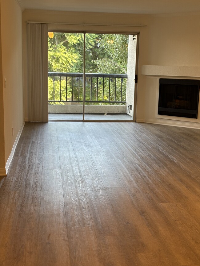 Living Room + Balcony + Fireplace - 5530 Owensmouth Ave