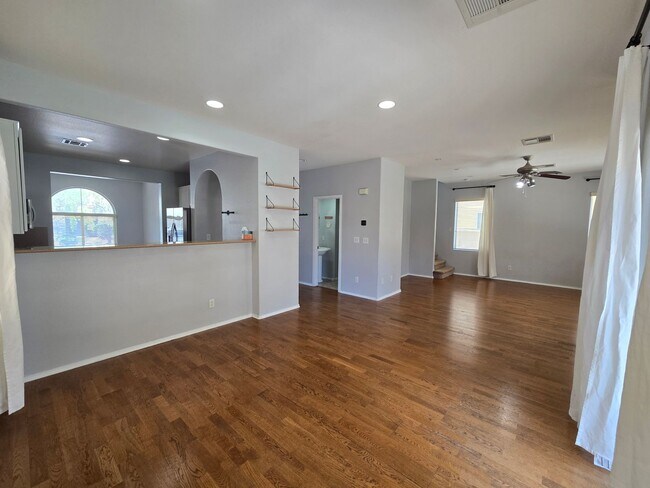 Building Photo - Step outside to a spacious, larger-than-average Las Vegas backyard complete with lush artificial ...