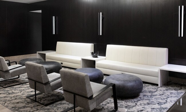 photo of 201 Pearl St Lobby with modern lighting, lounge seating, and convenient power outlets - 2 Gold St