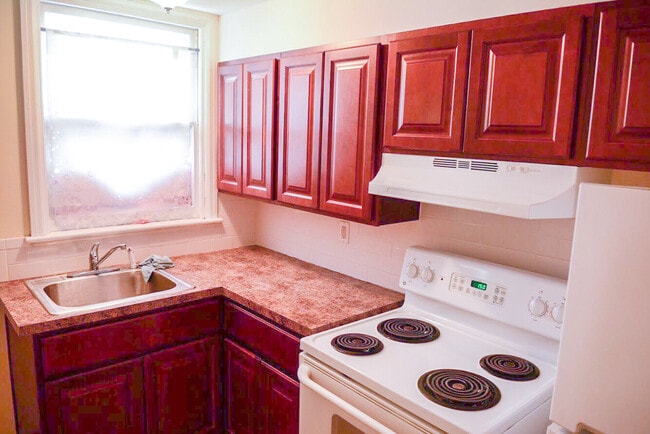 The newly remodeled kitchen also includes new appliances. It also features generous pantry and cupboard space. - 675 Spring Garden St