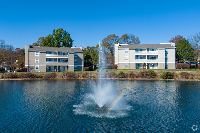 Building with Lake View - Mill Trace Village Apartments