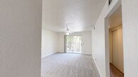 Located at 2950 W Portage Bay Ave in Davis, California, this two-bedroom, four-bathroom residence offers a functional single-floor layout designed for comfortable everyday living. The combined kitchen and living room serves as the central hub of the home, with the kitchen featuring white cabinetry, granite-style countertops, a stainless steel sink, a dishwasher, and wood-look flooring. Vertical blinds allow for adjustable natural light, and a sliding glass door in the living area provides access to an outdoor space. The living room is finished with plush carpeting and a ceiling fan overhead. Both bedrooms are carpeted and filled with natural light; the primary bedroom includes a ceiling fan and a sliding double-door closet offering generous storage. Additional bedrooms feature wide windows with vertical blinds. The four bathrooms are consistently appointed with wood-look flooring, white vanity cabinetry, granite-style countertops, wall-mounted mirrors, and sliding-glass-door shower-tub combinations. A connecting hallway ties the rooms together cohesively. The overall aesthetic is clean and neutral, with cream-toned walls and white trim throughout, creating a bright and move-in-ready environment.