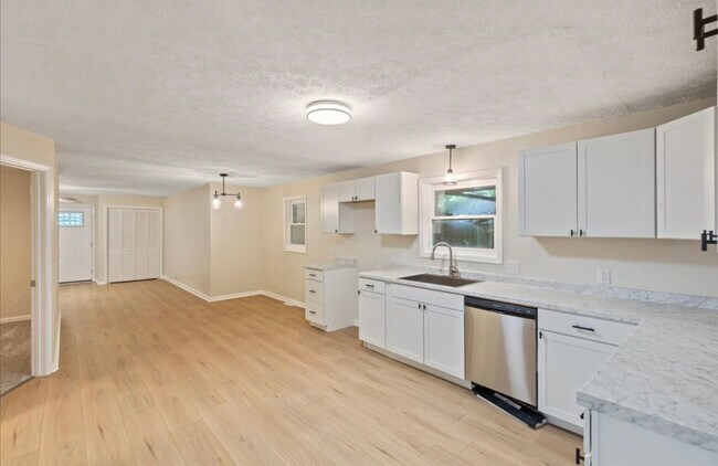 Large kitchen features stainless appliances, gas range and island - 6362 E County Road 200 N