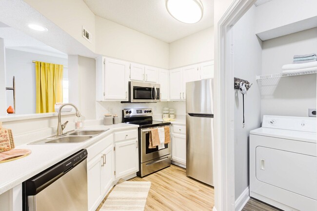 Kitchen with Stainless Steel Appliances - Walnut Hill Apartments