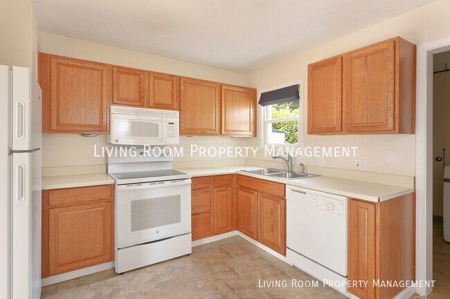 Foto del edificio - Warm and Inviting Bungalow with Fully Fenc...