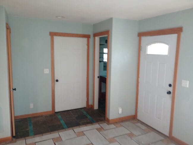 From living area door bathroom, to garage, and storage closet - 3921 E 15th Ave