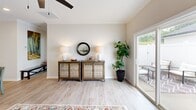 Located at 102 Whistle Stop Circle in Lenoir City, Tennessee, this well-appointed single-story, 2-bedroom, 2-bathroom home offers a thoughtfully designed layout with modern finishes throughout. Light hardwood-style flooring flows seamlessly across the entire living space, creating a warm, cohesive aesthetic.

The open-concept kitchen is a standout feature, showcasing crisp white shaker cabinets, granite countertops, a spacious center island with bar seating, pendant lighting, and stainless steel appliances, including a refrigerator, range, and microwave. Crown molding and recessed lighting add refined detail to the kitchen and adjoining living room, which features a ceiling fan and access to a private outdoor patio through sliding glass doors.

The primary bedroom is generously sized, complete with a ceiling fan and an ensuite bathroom featuring a dual-sink granite vanity and light hardwood flooring. A dedicated walk-in closet with wire shelving and wood upper shelving provides ample storage. The second bedroom is bright and comfortable, offering a window with natural light and its own ceiling fan. The second bathroom includes a granite vanity and a full tub-shower combination. A utility room and additional closet space round out this practical and attractive home.