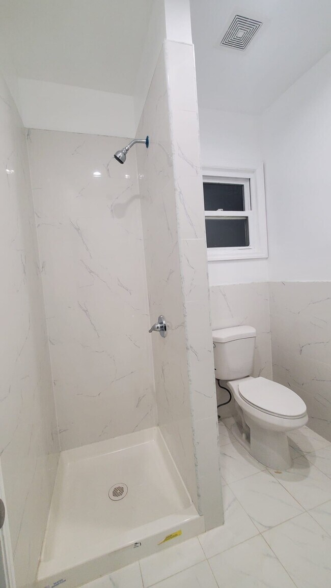 Floor to ceiling tile shower - 3921 108th St