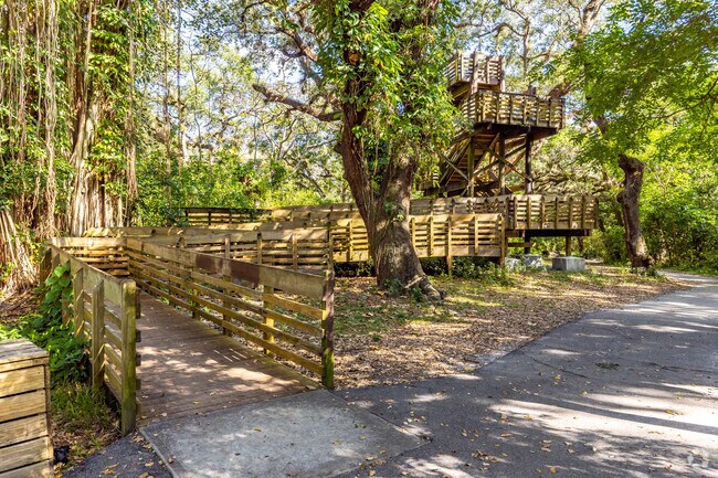 A tower and walking trails inside Tree Tops Park.