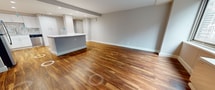 This contemporary 830 square foot apartment offers a blend of style and functionality in the heart of Philadelphia. The space is characterized by its expansive hardwood flooring, which flows seamlessly through the entire unit, creating a warm and cohesive aesthetic. The open-concept living area is bathed in natural light, courtesy of large windows that provide stunning city views.

The kitchen is a highlight, boasting crisp white cabinetry, stainless steel appliances, and a unique marble-patterned backsplash. It's equipped with modern amenities including a built-in microwave and a sleek electric range, perfect for culinary enthusiasts.

The bedroom is generously sized at 250 square feet, offering ample space for relaxation and storage. The bathroom continues the modern theme with clean lines, a large vanity, and subway tile accents in the shower area.

A notable feature is the walk-in closet, providing excellent storage solutions. Throughout the apartment, recessed lighting adds to the contemporary ambiance. The unit's single floor layout ensures easy accessibility, while its location in a multi-story building suggests the possibility of elevators and additional amenities. This apartment seamlessly combines urban living with comfort and style.