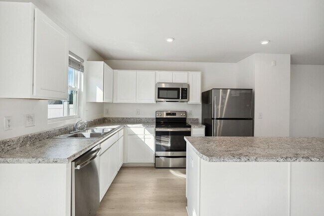 Foto del edificio - Light and bright 4 bed/ 2,5 bath with fenced back yard and practical glamour!