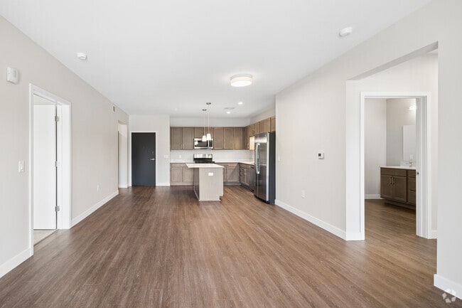 3BR, 3BA - 1,480SF - Kitchen and Living Room - Brightdawn Village Apartments