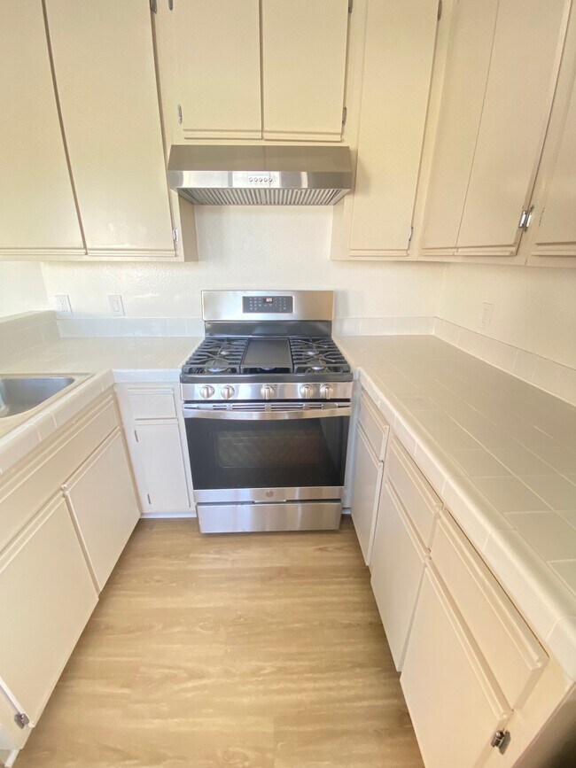 Brand new stainless steel appliances: stove, refrigerator, and dishwasher - 564 N Ardmore Ave