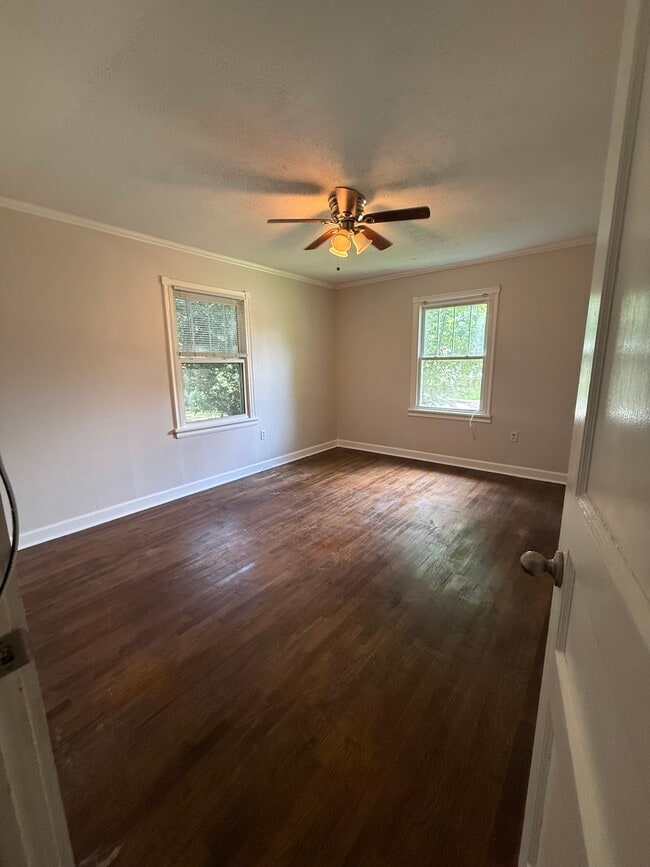 Spacious primary bedroom offering a comfortable retreat with generous closet space - 823 Rittiner Dr
