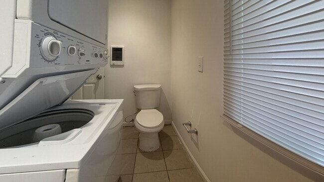 Photo - Charming 4BR/2BA Rowhouse with Hardwood-Style Flooring Throughout