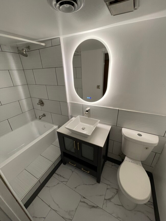 Remodeled bathroom with tub & Bluetooth LED mirror - 3708 W Dickens Ave